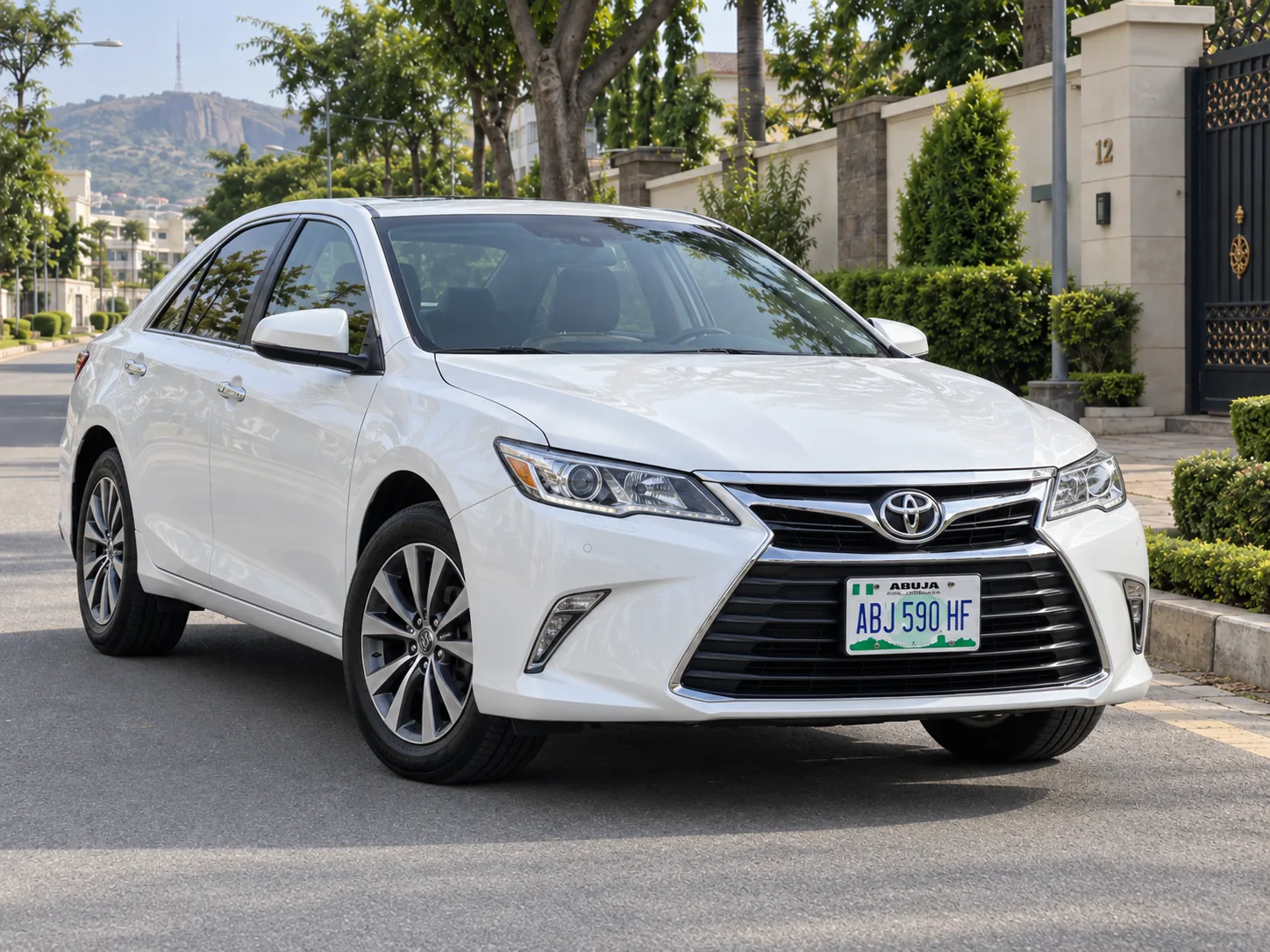 White Toyota Camry 2017 self drive rental Abuja